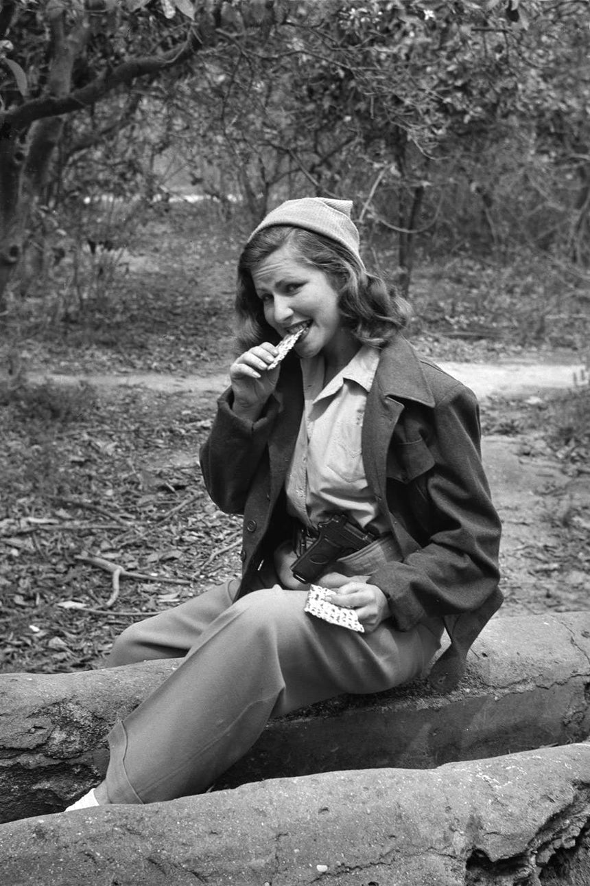 Girl with Matza and a Pistol